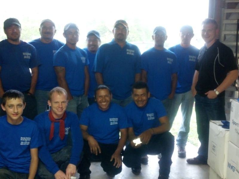 Sam The Roof Man in the early days with a roofing crew in matching blue shirts