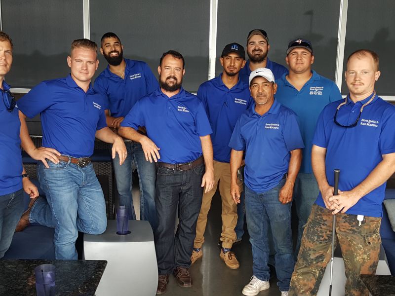Sam with his sales team in matching blue polos